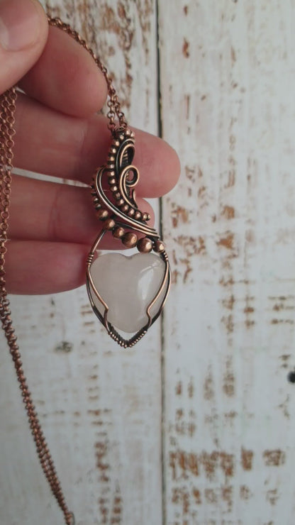 Copper wire-wrapped heart shaped pink rose quartz pendant