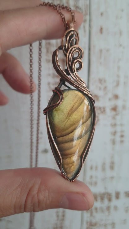 Yellow teardrop labradorite gemstone talisman.