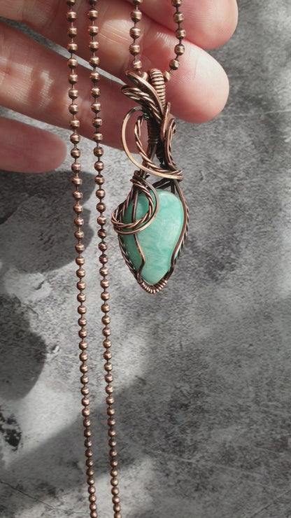 Copper wire wrapped amazonite pendant.