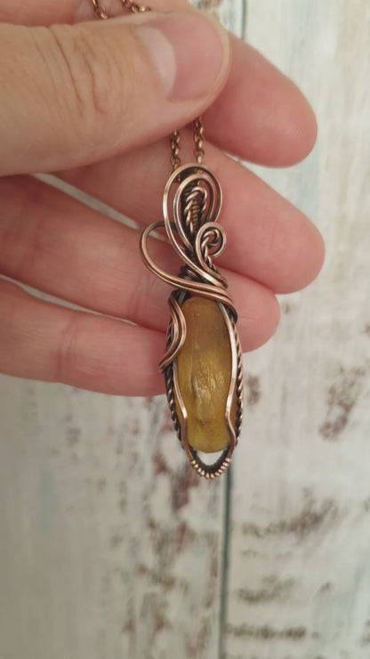 Copper wire wrapped raw Baltic amber pendant