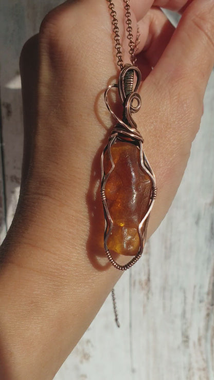 Wire wrapped raw Baltic amber pendant