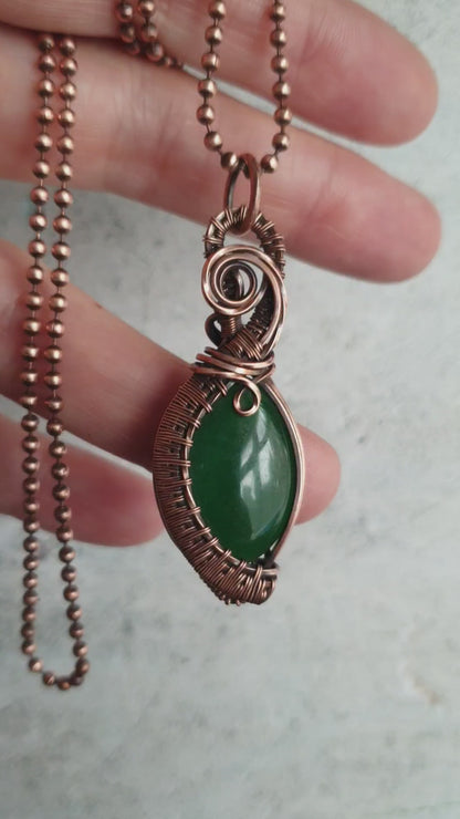 Copper wire weaved green jade pendant